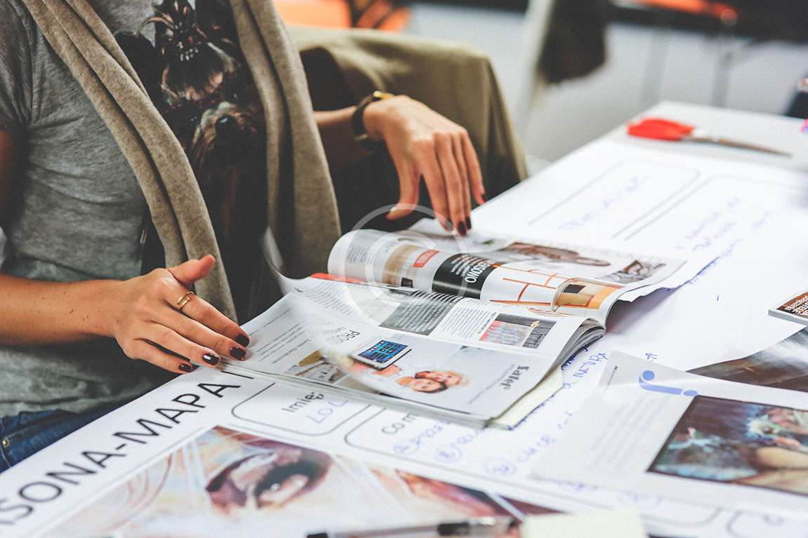 kaboompics.com_Girl-reading-a-newspaper.jpg